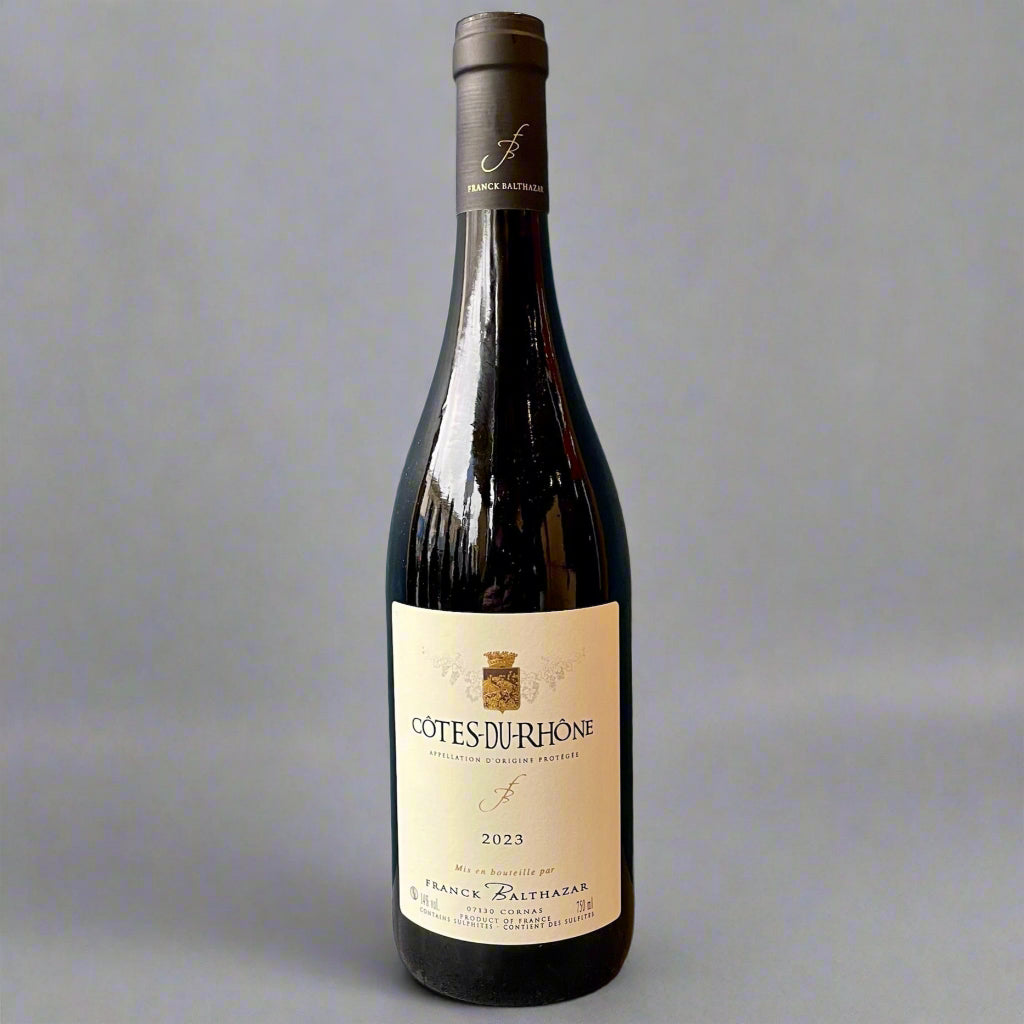 Top Bottle of Côtes du Rhône Rouge by Franck Balthazar, a silky, fruit-forward Rhône red with floral notes and a pure, slate-like finish.